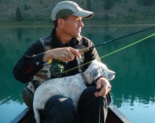 Canoe fishing with puppy