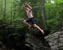 Jumping into swimming hole